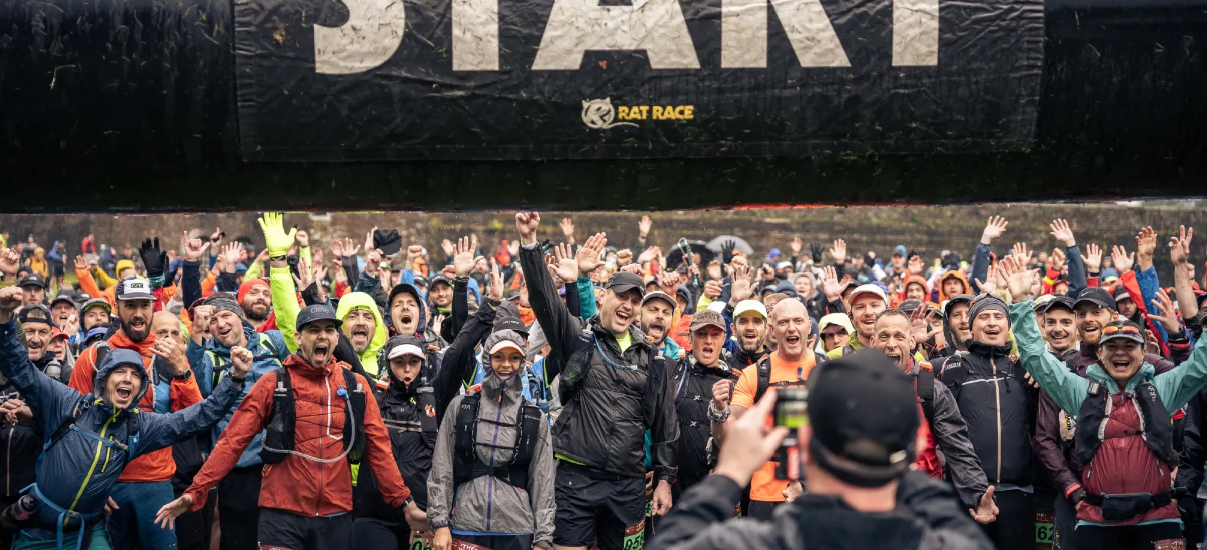 Excited people waiting at start arch