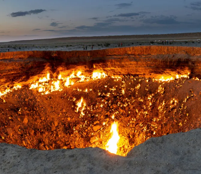 Crater in ground on fire