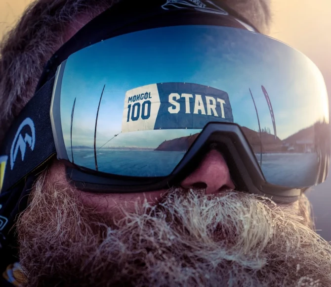 Reflection of start line in man's goggles