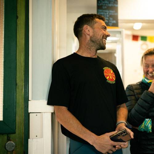 Man holding his phone and laughing