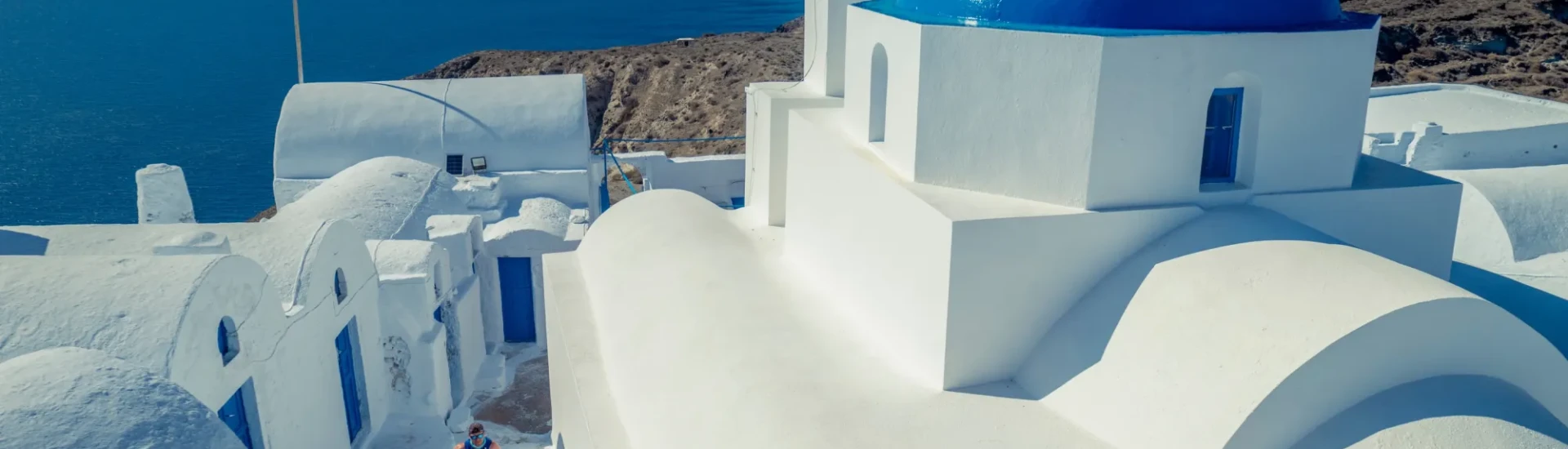 Participant running through white buildings