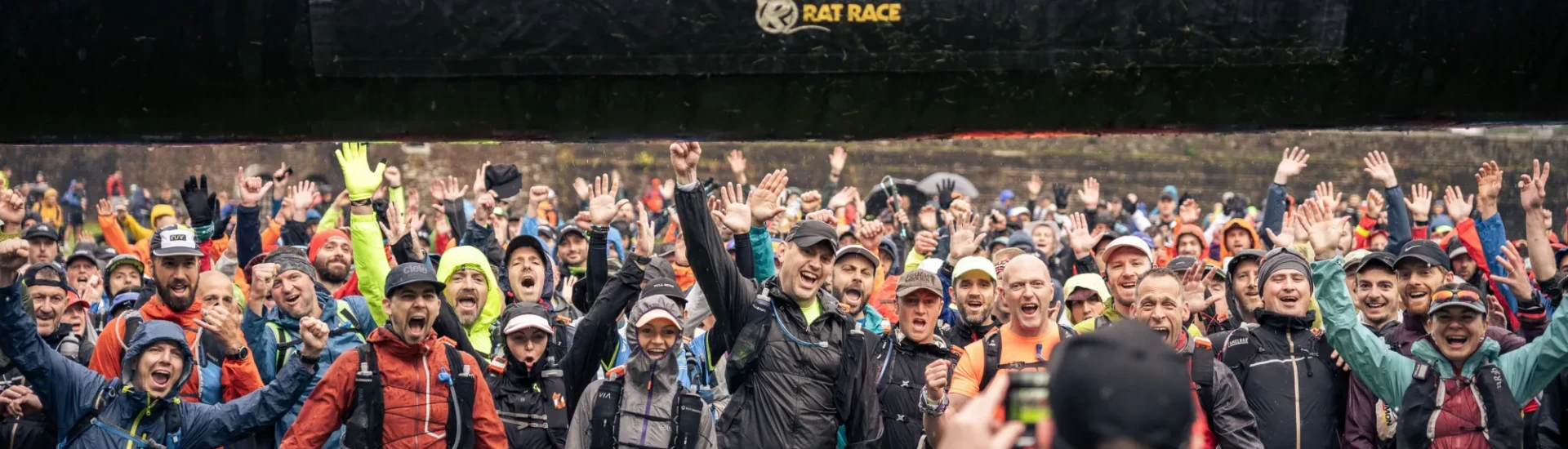 Excited people waiting at start arch