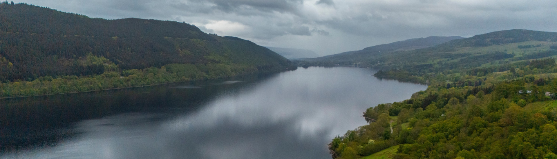 Large body of water with trees either side