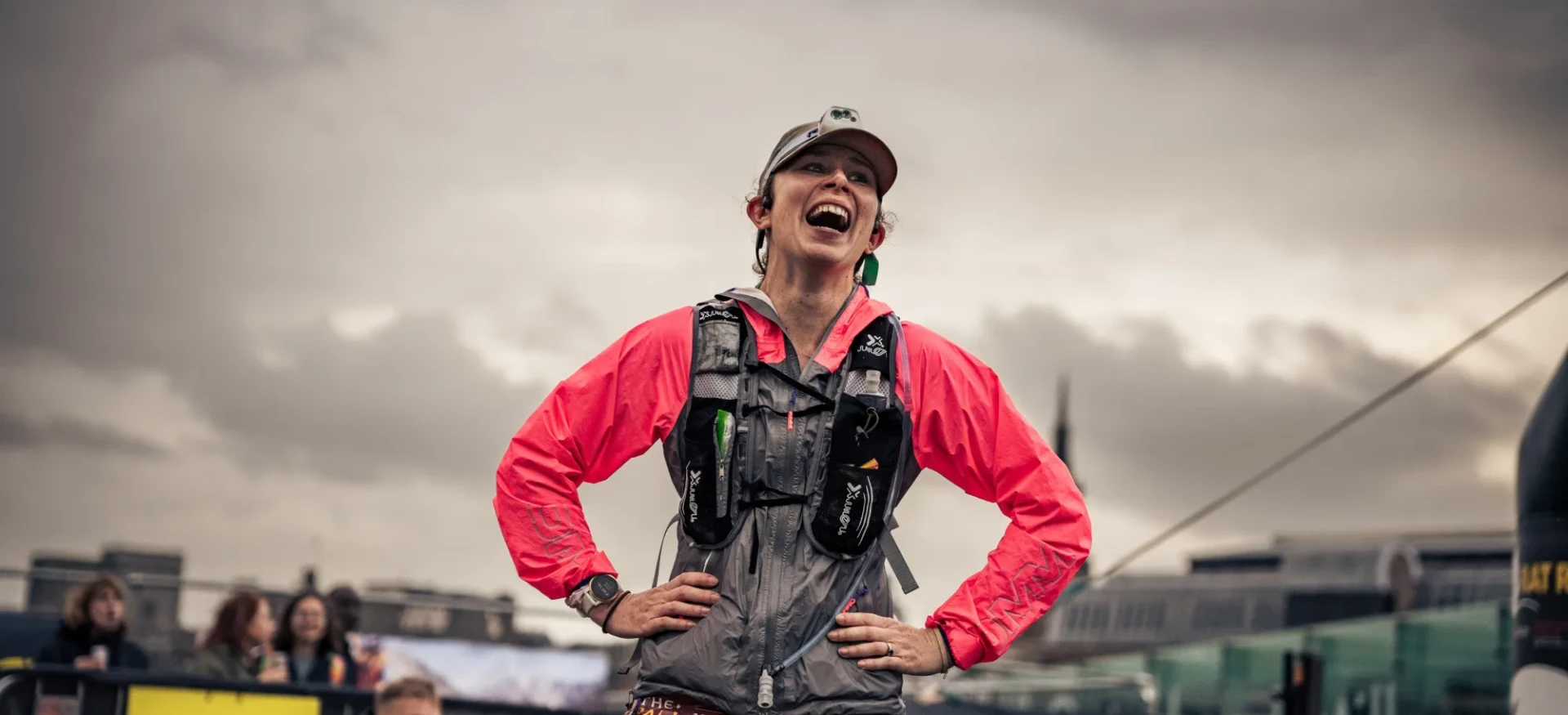 Woman smiling with grey sky above her