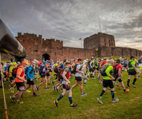 People running past of castle
