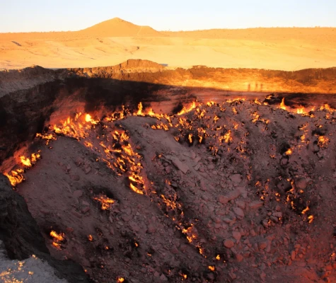Crater in ground on fire