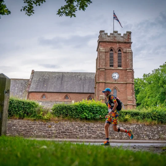Man running past church