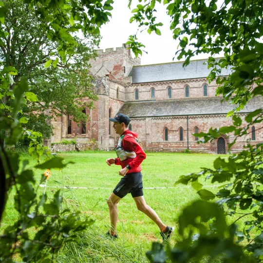 Man running past church