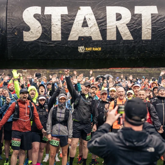 Excited people waiting at start arch
