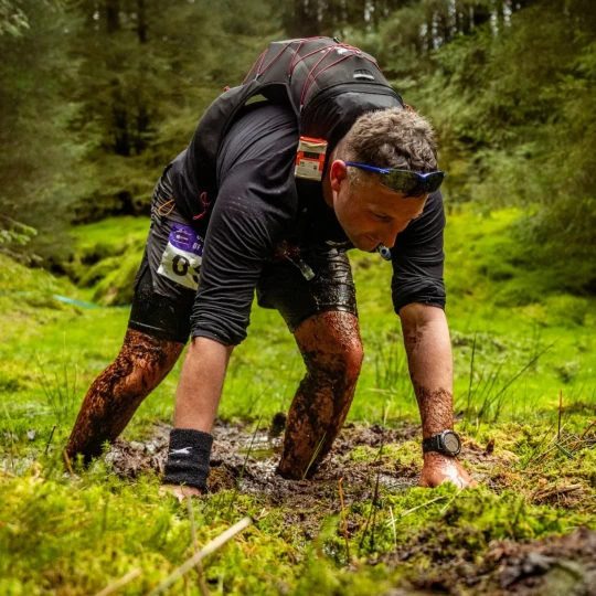 Man climbing through bog