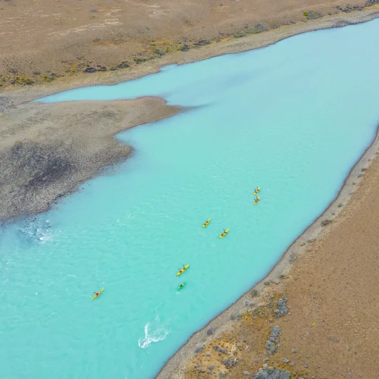 Aerial view of participants kayaking through clear water