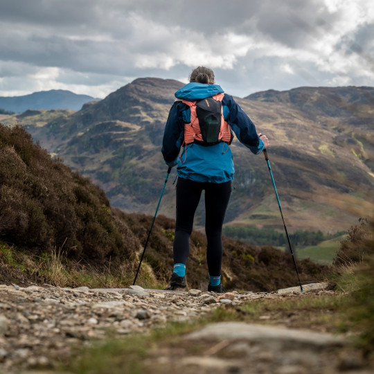 Woman walking along rocky path