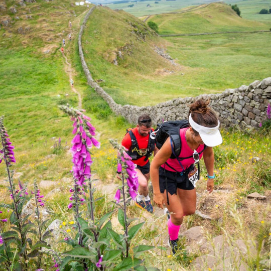 Man and woman walking along Hadrian's Wall