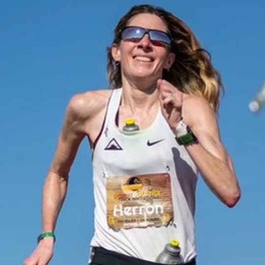 Woman smiling and running