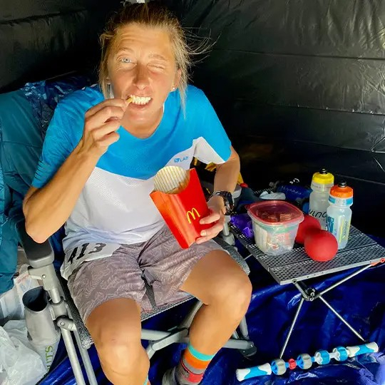 Woman winking and eating McDonalds