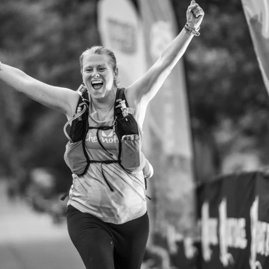 Woman celebrating at finish