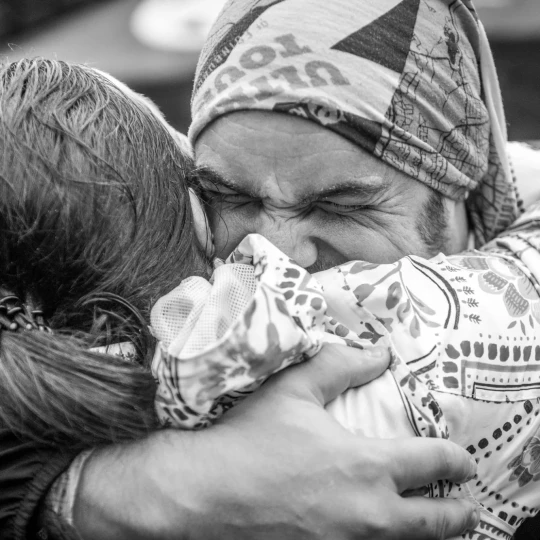 Close up of people hugging