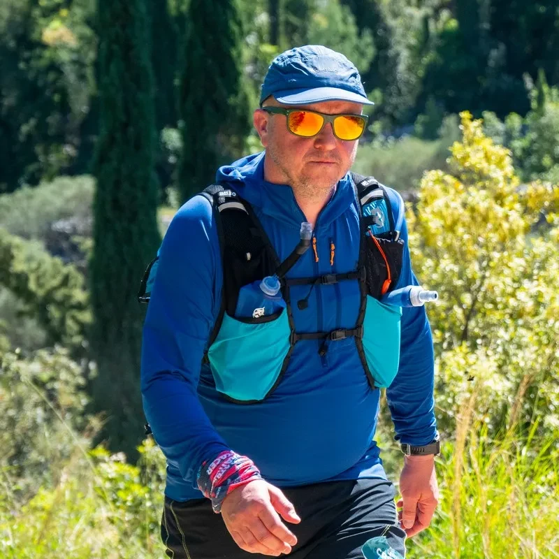 Man walking through trees