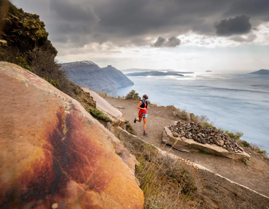 Woman running on coastal path