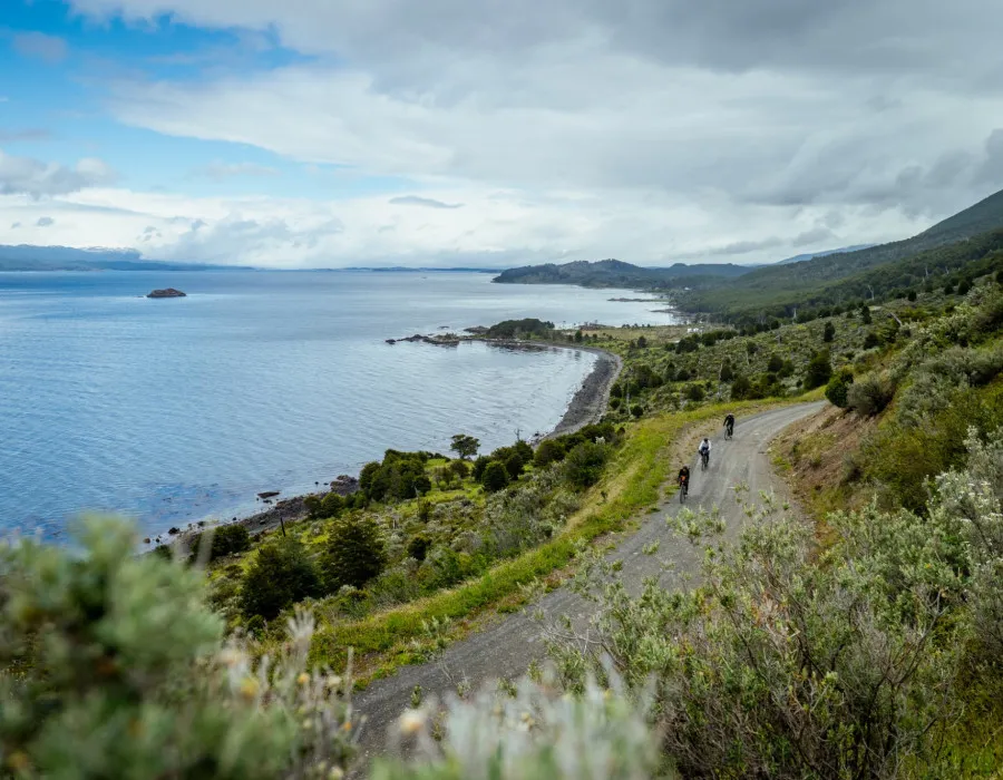 Cyclists riding along rocky path