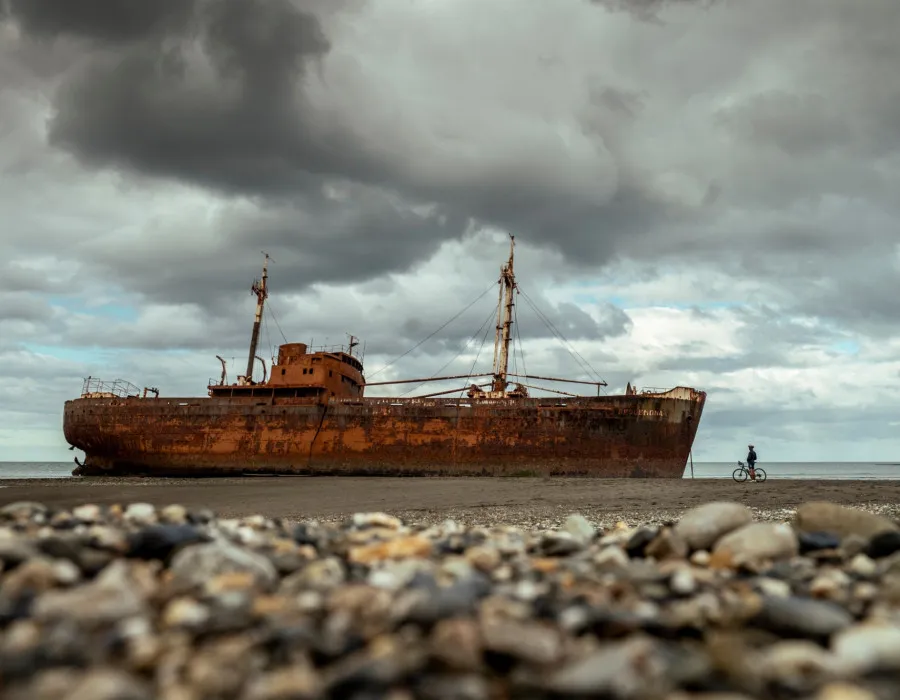Cyclist stopping to look at shipwreck