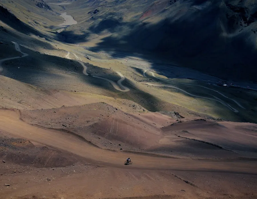 Cyclist riding along dusty path