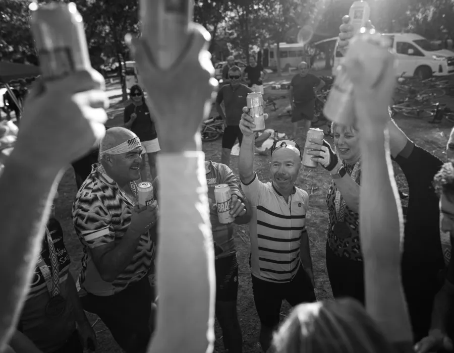 People smiling and celebrating with drinks