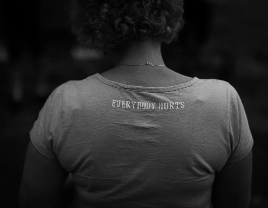 Woman wearing 'Everybody Hurts' t-shirt