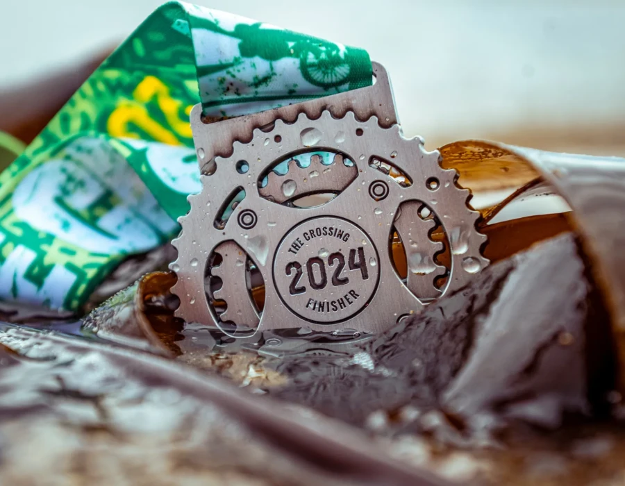 The Crossing 2024 medal in water