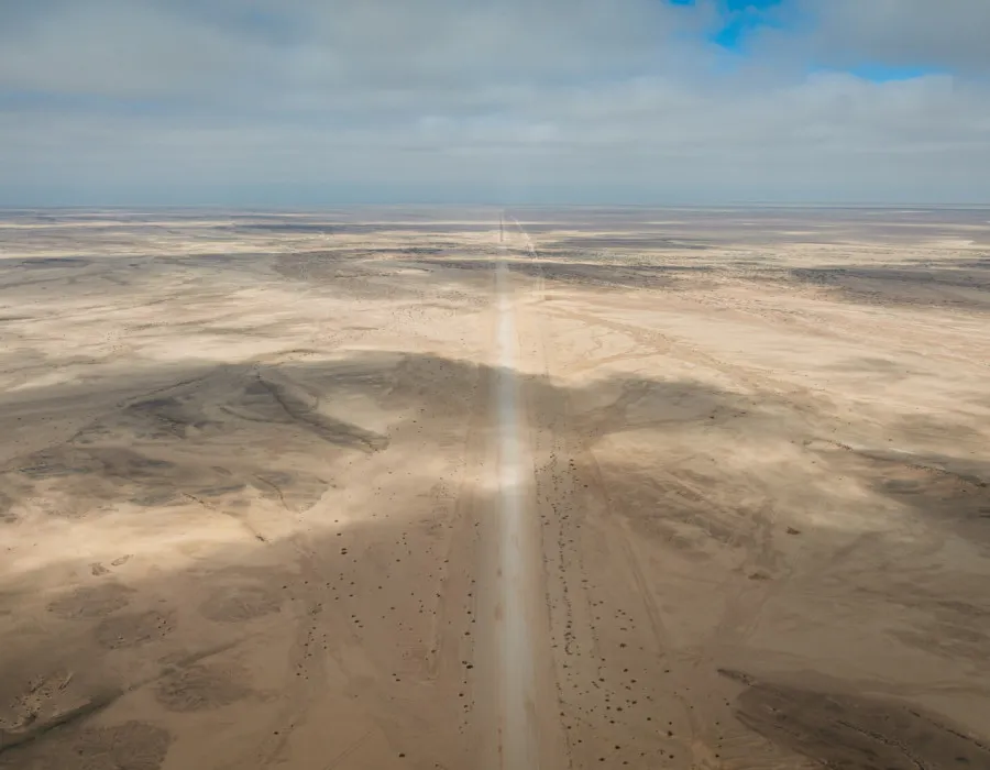 Road running through dry desert