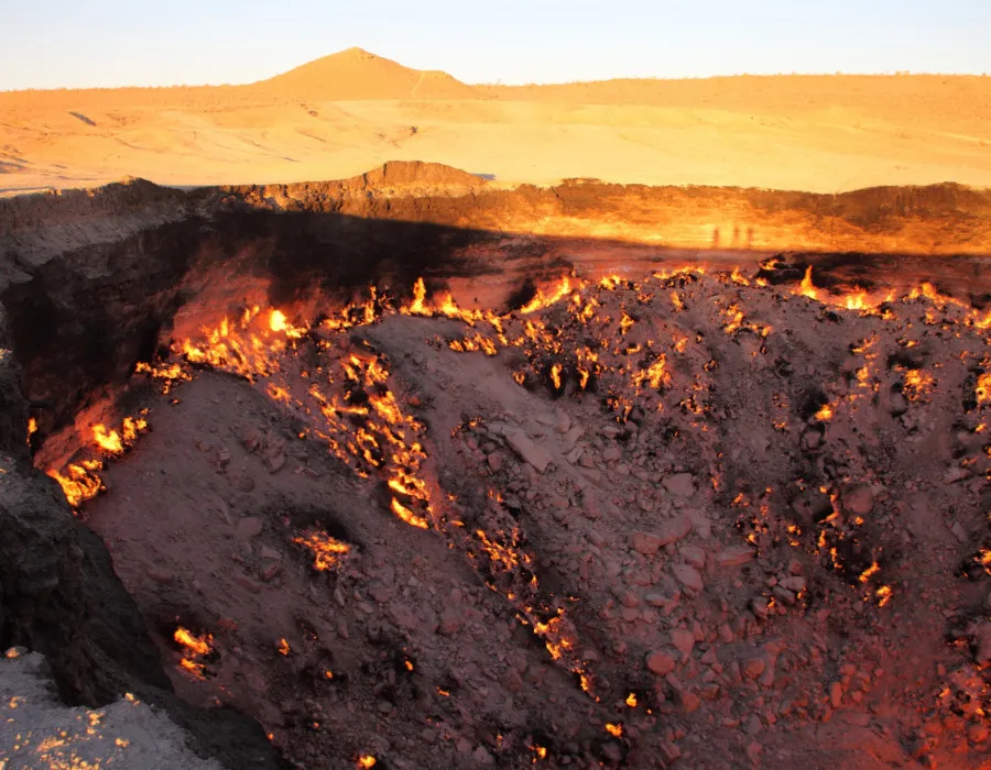 Crater in ground on fire