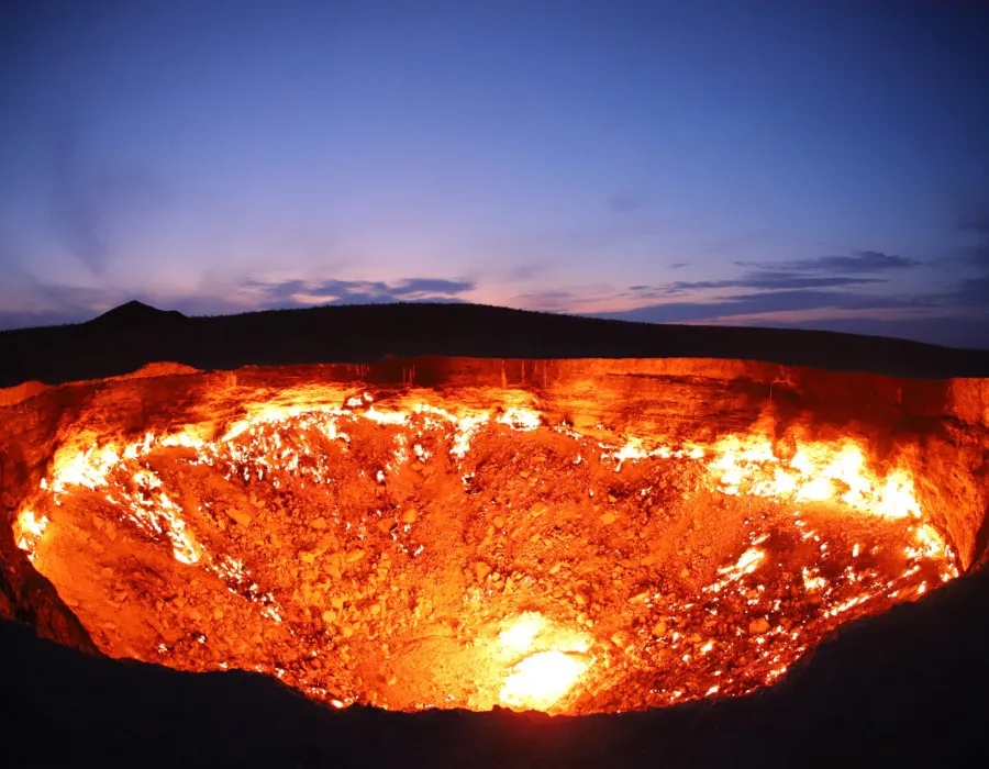 Crater in ground on fire