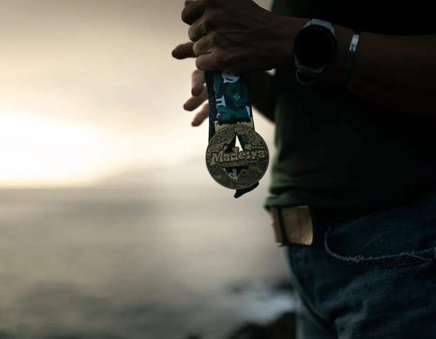 Participant holding a Madeira medal