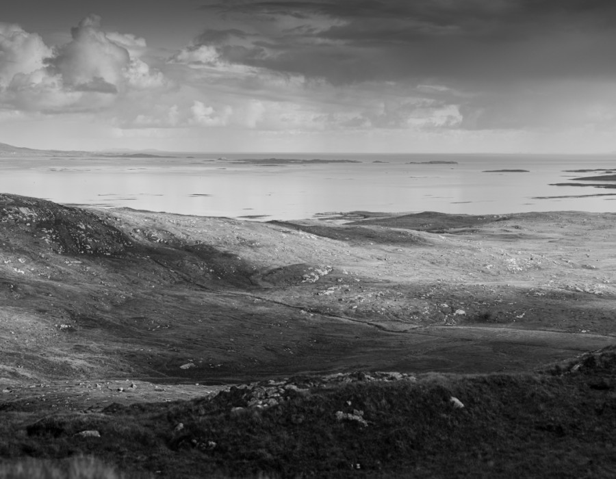 Dark landscape with clouds above