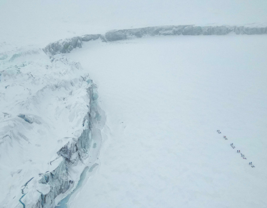 Aerial view of participants walking through snow