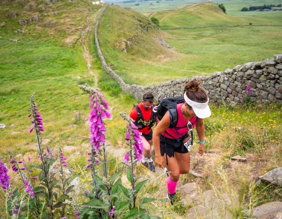 Man and woman walking along Hadrian's Wall