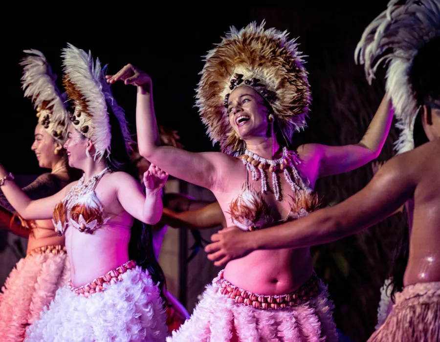 Performers wearing head wear and dancing
