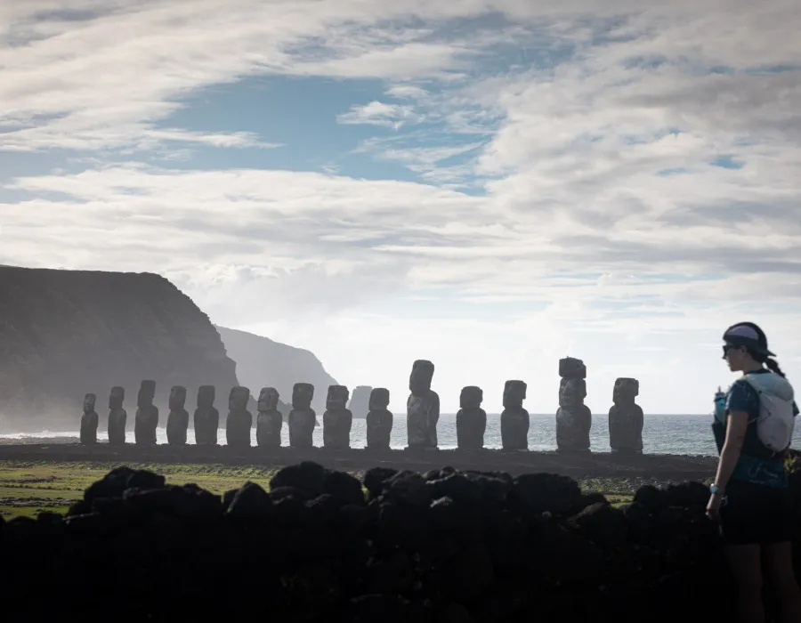 Female participant looking out to a line of statues
