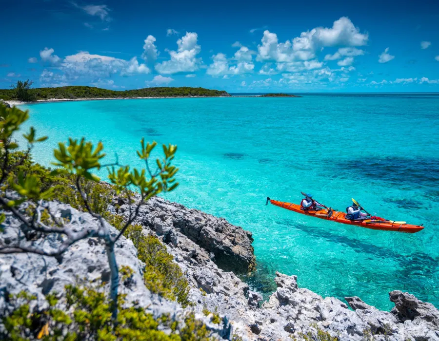 Two participants kayaking on clear waters