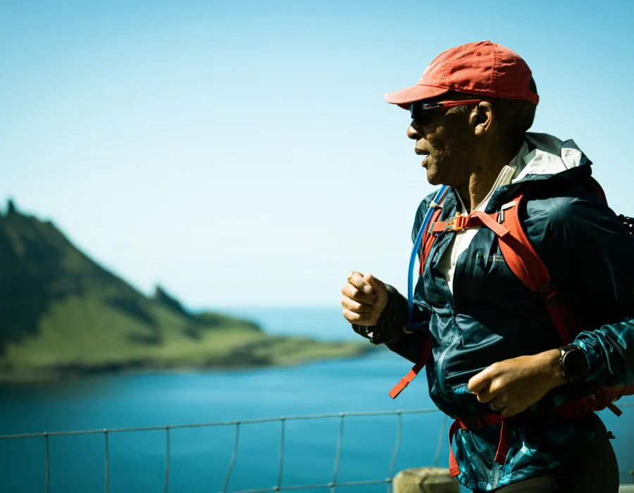 Man running along coastal path