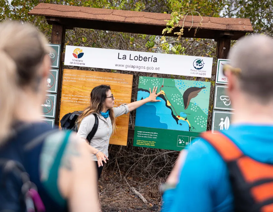 Woman pointing at a sign