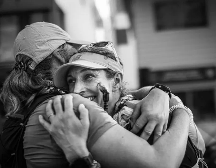 Two women hugging and smiling