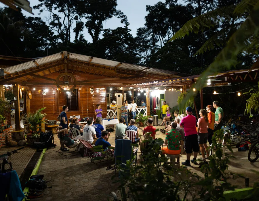 Participants crowded round a wooden building