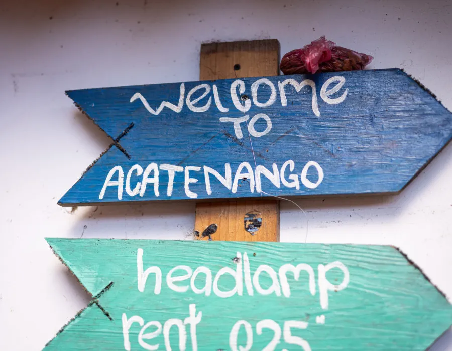 Blue arrow signs attached to a piece of wood