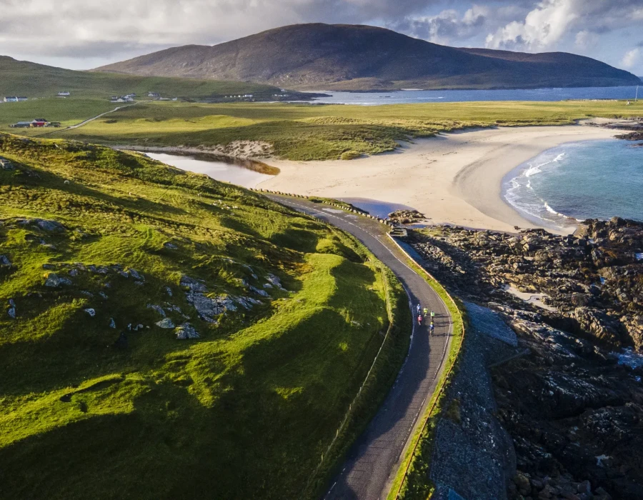 Cyclists riding along coastal road