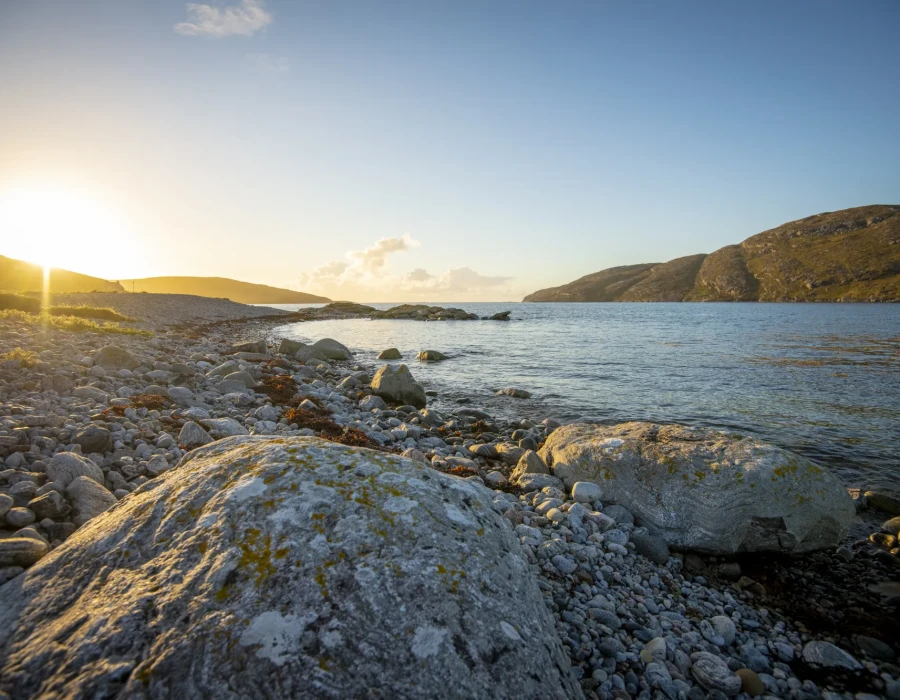 Rocky shoreline and clear, still sea