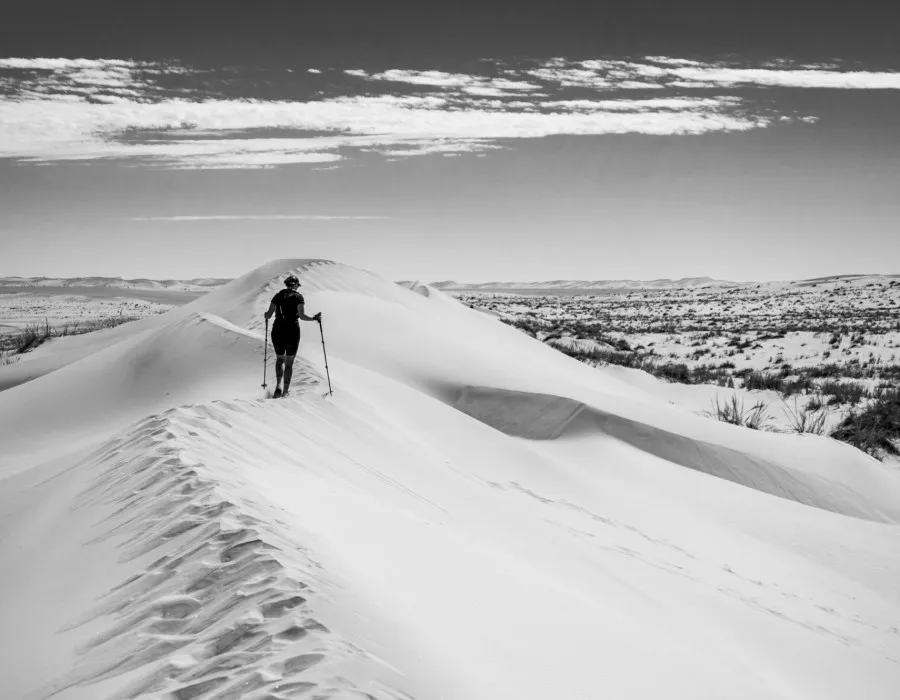 Participant walking along a sand dune