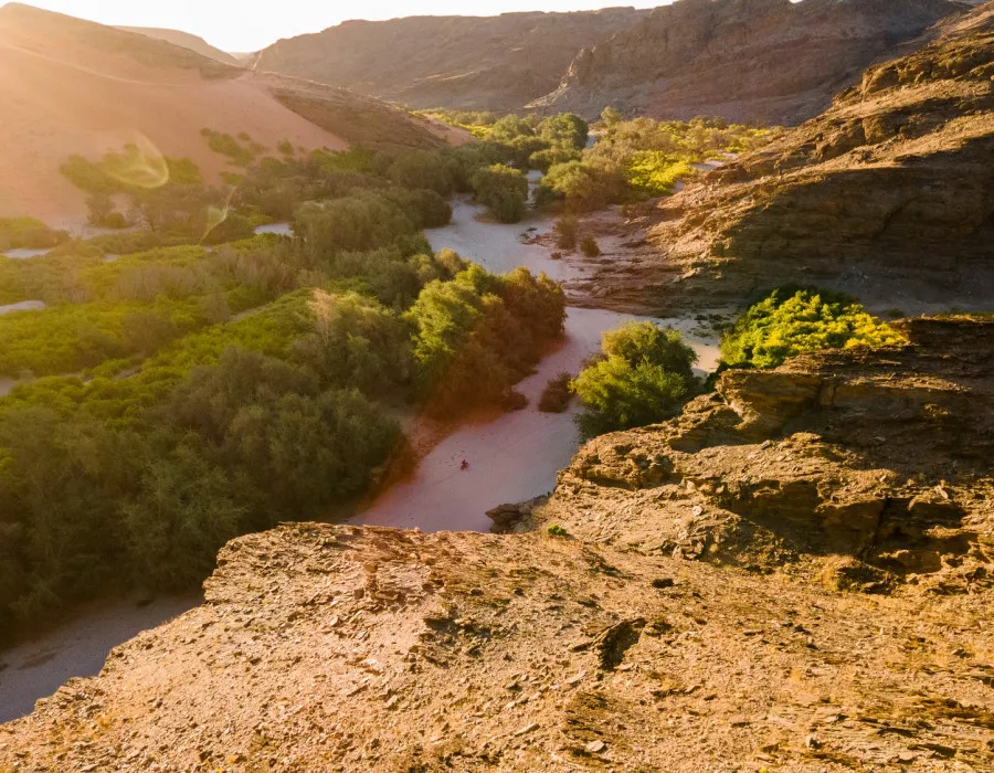 River travelling through greenery and rocky terrain