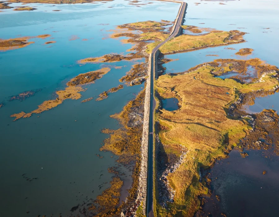 Road through water with patches of greenery
