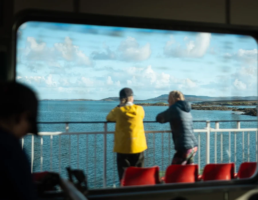 People looking out across water
